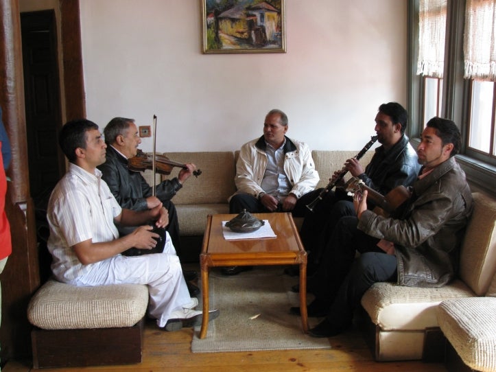A group of Romani musicians warming up for a gig in Vranje.